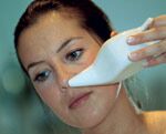 Women using nasal rinse pot